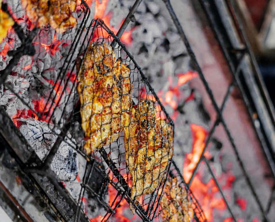 Bali: Jimbaran Seafood Market Tour with Sunset Dinner - From market purchase to coconut-coal grill