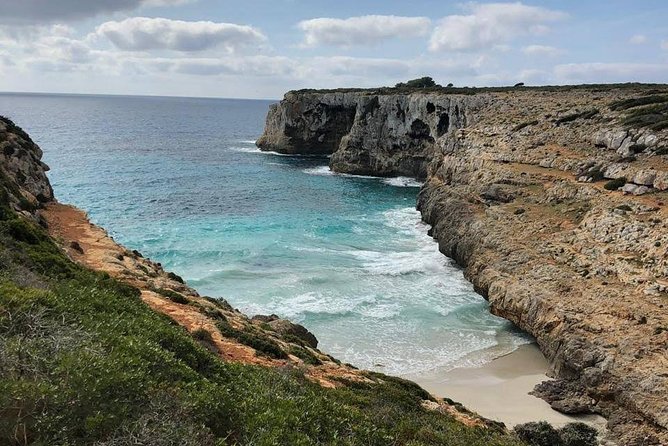 Cala Romantica Water Cave Adventure - Entering the Cave Through a Coastal Tunnel