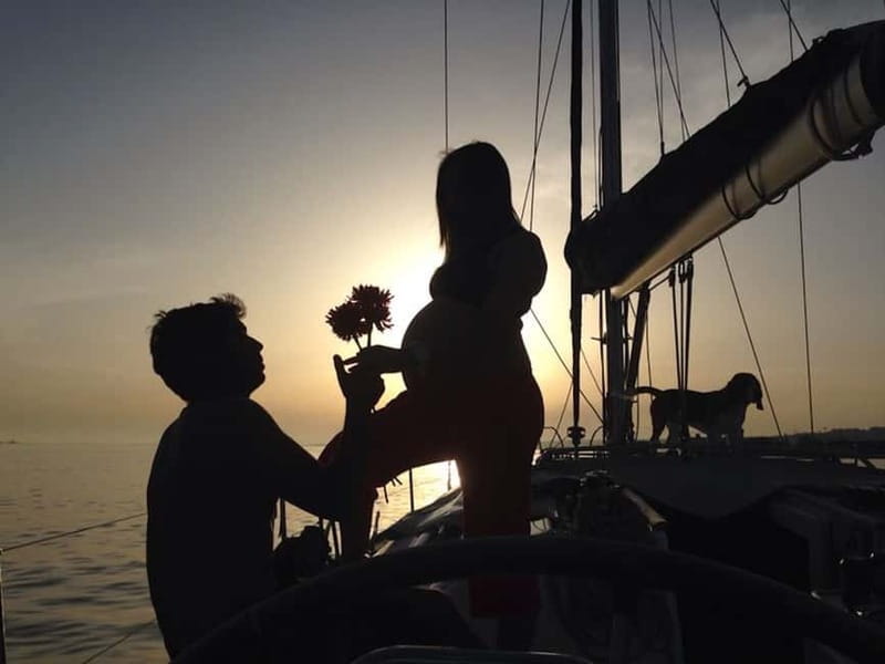 Lisbon: Romantic Cruise with Wine & Portuguese Tapas - A sunset view of Lisbon from the Tagus