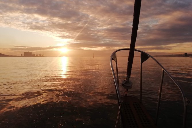 Marriage proposal on a Vintage Sailboat - Looking across to Cristo Rei