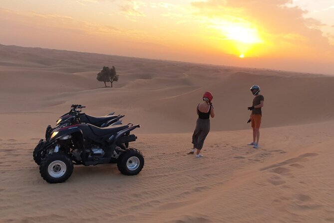 Private Dinner in middle of desert with sunset quad bike tour - Quad biking as the sun drops over the dunes