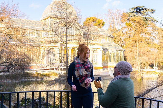 Private Photo Session Tour for Couples in Madrid - The Almudena Cathedral viewpoint frames two Madrid landmarks