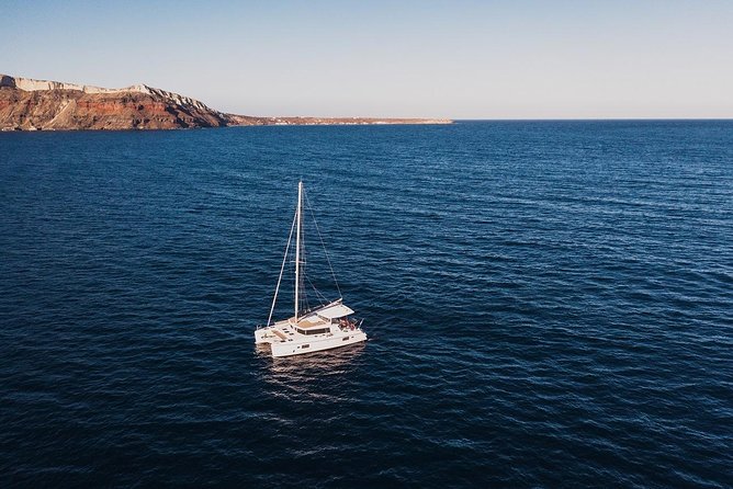 Romantic Sunset Catamaran Caldera Cruise incl. Meal & Drinks - Sailing toward Oia and Ammoudi Bay