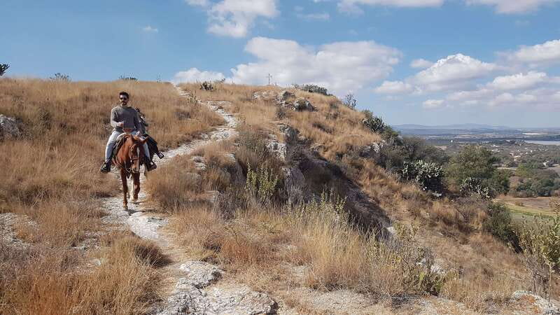 San Miguel: Romantic Horseback Riding at Sunset - Descending toward Colonia San Antonio