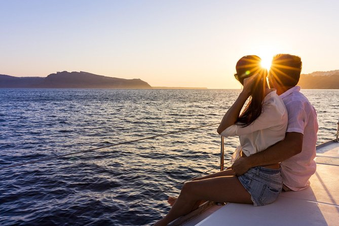 Shared Catamaran Romantic Sunset Cruise from Santorini via Volcano - White Beach and the volcanic coast