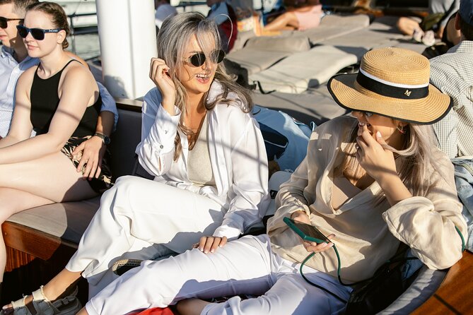 Sunset Dinner Cruise: Sunset, Swim, Drinks, and Dinner Onboard - What the crew adds to the evening