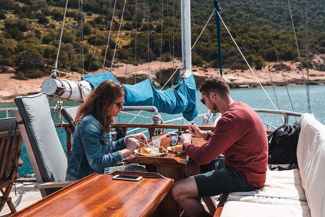 Sunset Dinner Cruise: Sunset, Swim, Drinks, and Dinner Onboard - Booking, weather, and cancellation details