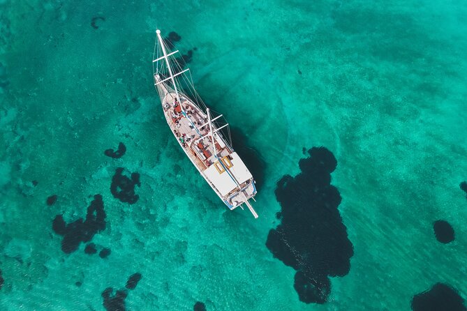 Sunset Dinner Cruise: Sunset, Swim, Drinks, and Dinner Onboard - Two swim stops near Ydrousa and Vouliagmeni