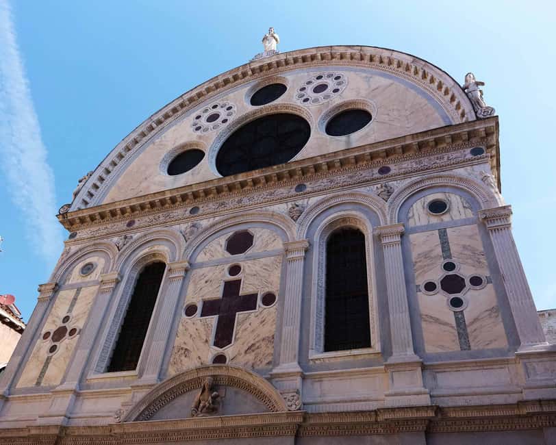 Venice: Winter Walking Tour & Romantic Gondola Ride Upgrade - The Scuola Grande di San Marco, a grand facade with a practical past