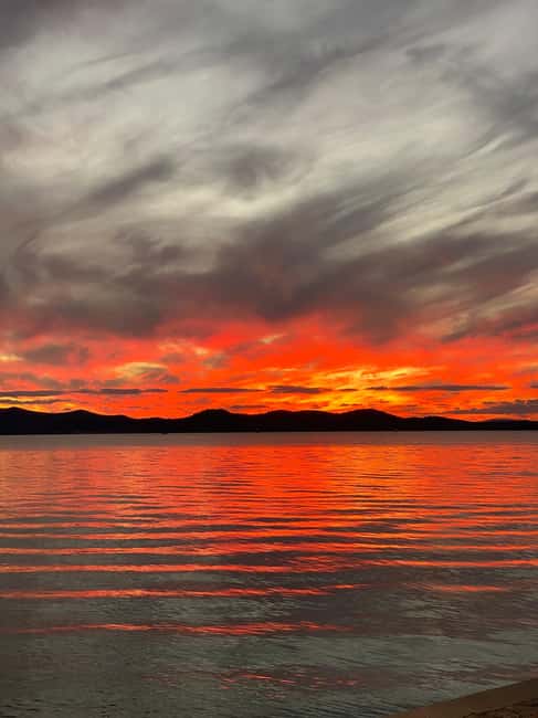 Zadar: Romantic Sunset Boat Tour with Champagne - Under the bridge and toward the old town